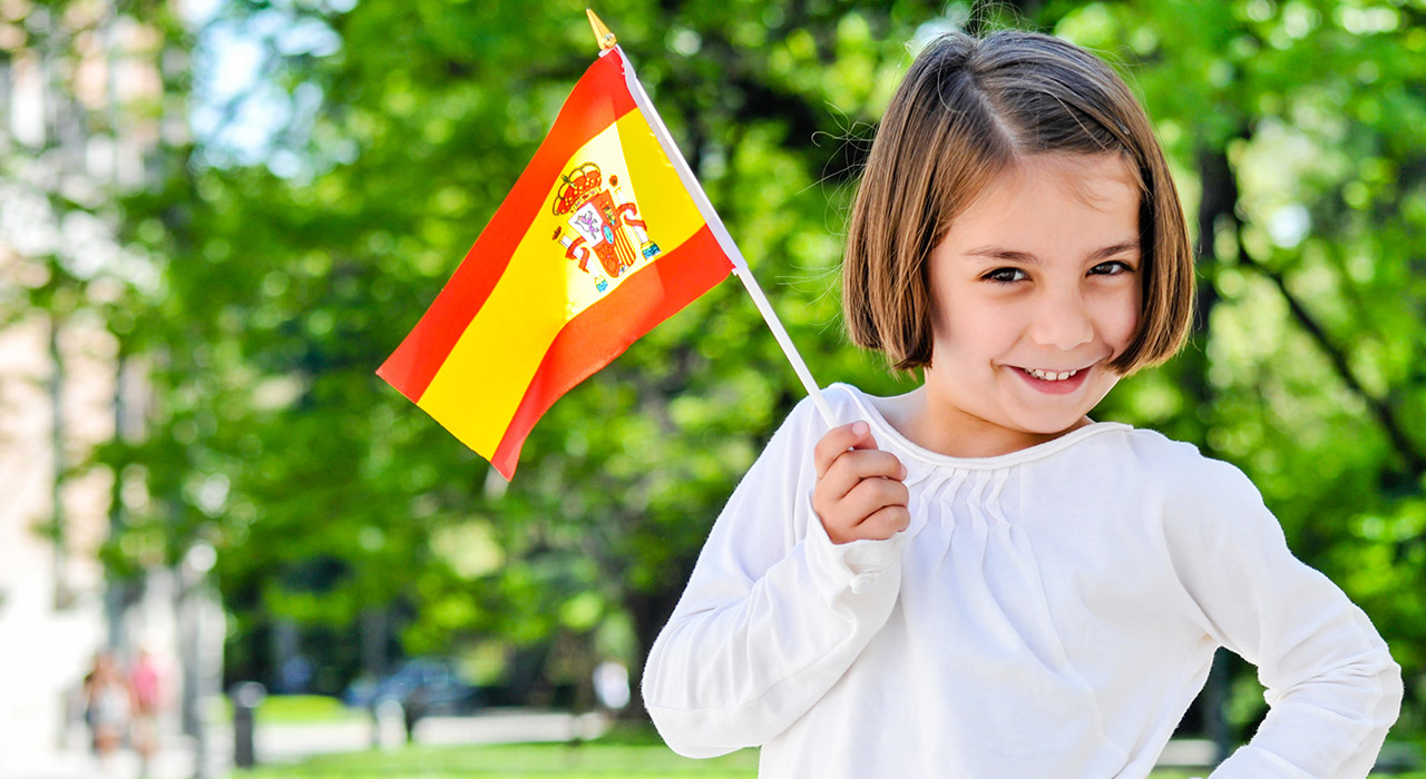 Cheerful Young Girl With Spanish Flag