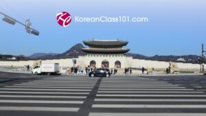 KoreanClass101 logo over the Gwanghwamun gate at Gyeongbokgung Palace, Seoul