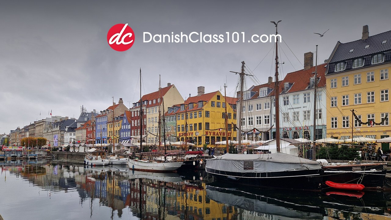 DanishClass101 logo over the coloured harbour houses of Nyhavn, Copenhagen