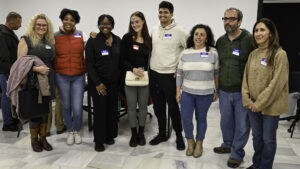Spanish and English learners wearing name tags at a language exchange in Rota, Spain